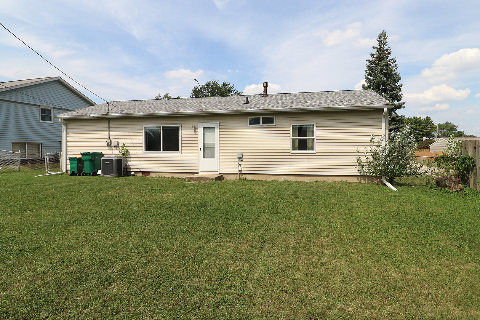 231 Murphy Drive Romeoville, IL 60446 - Photo 13 of 14 a front view of house with yard and green space