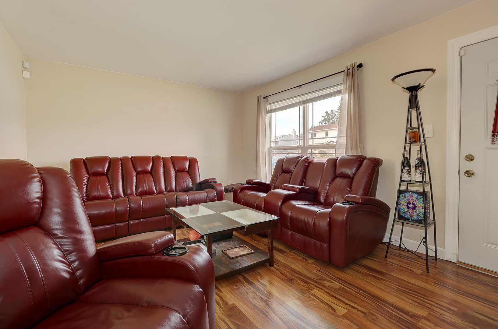 231 Murphy Drive Romeoville, IL 60446 - Photo 4 of 14 a living room with furniture a couch and a window
