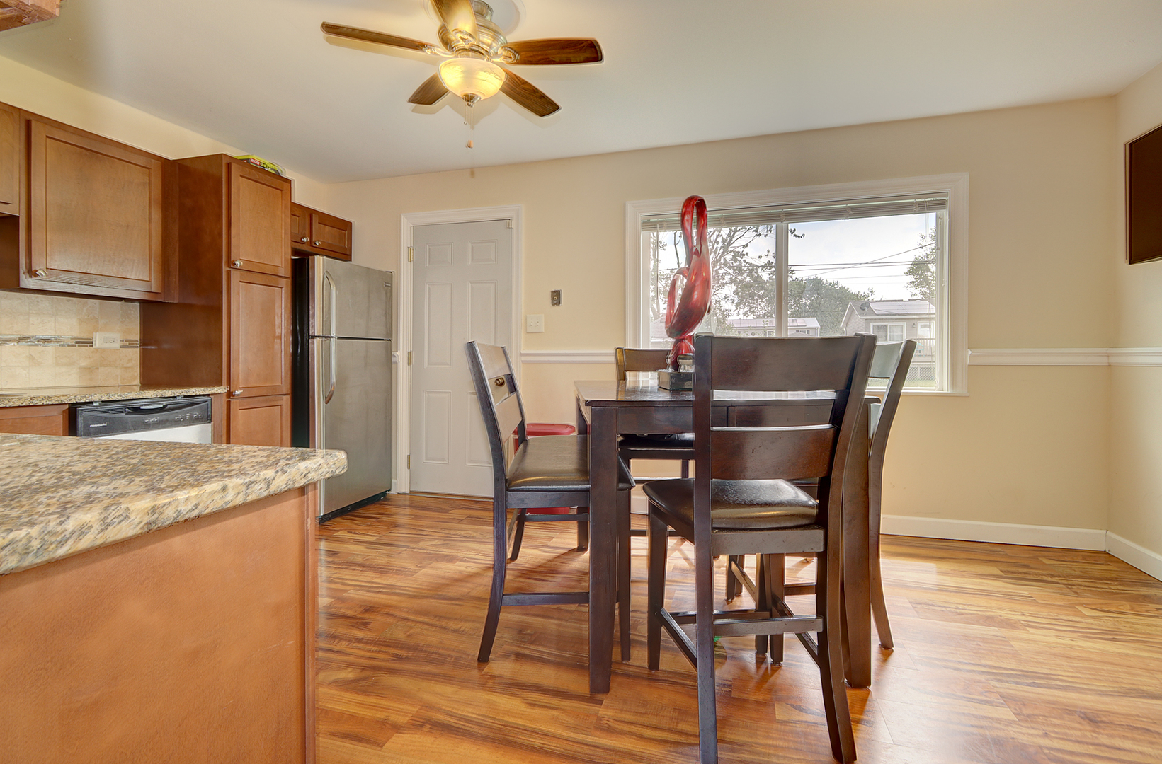 231 Murphy Drive Romeoville, IL 60446 - Photo 8 of 14 a view of a dining room with furniture and wooden floor