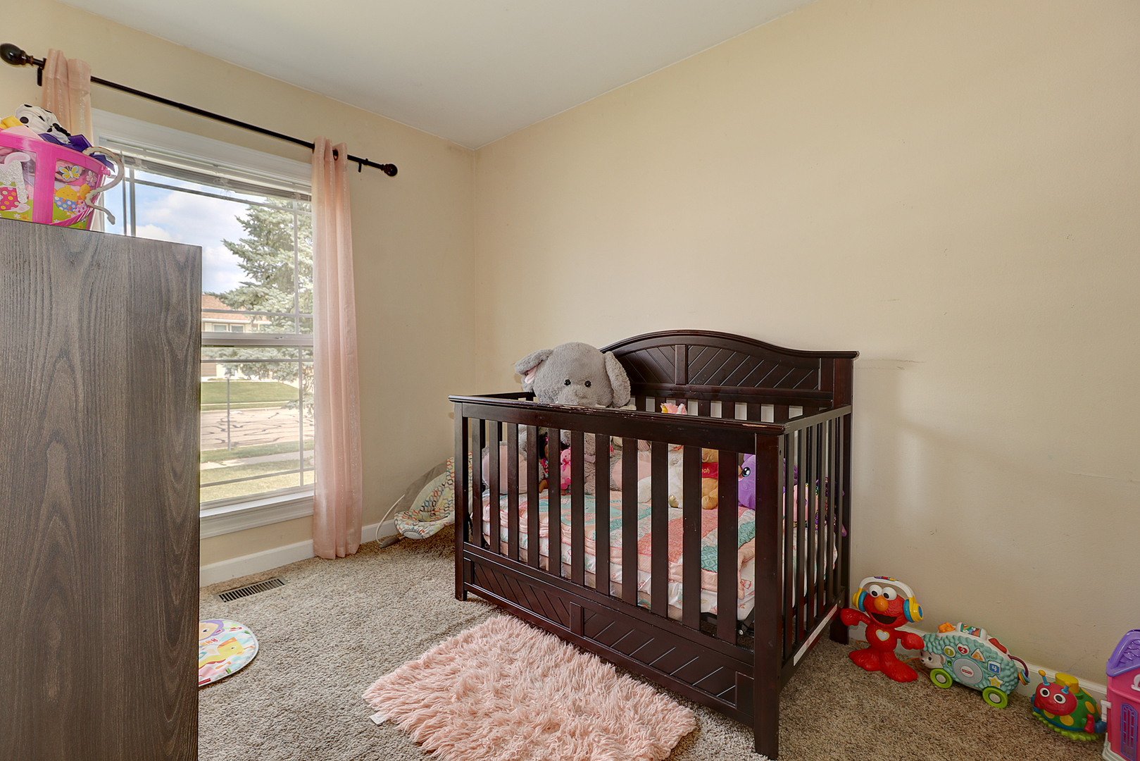 231 Murphy Drive Romeoville, IL 60446 - Photo 10 of 14 a bedroom with furniture and a window