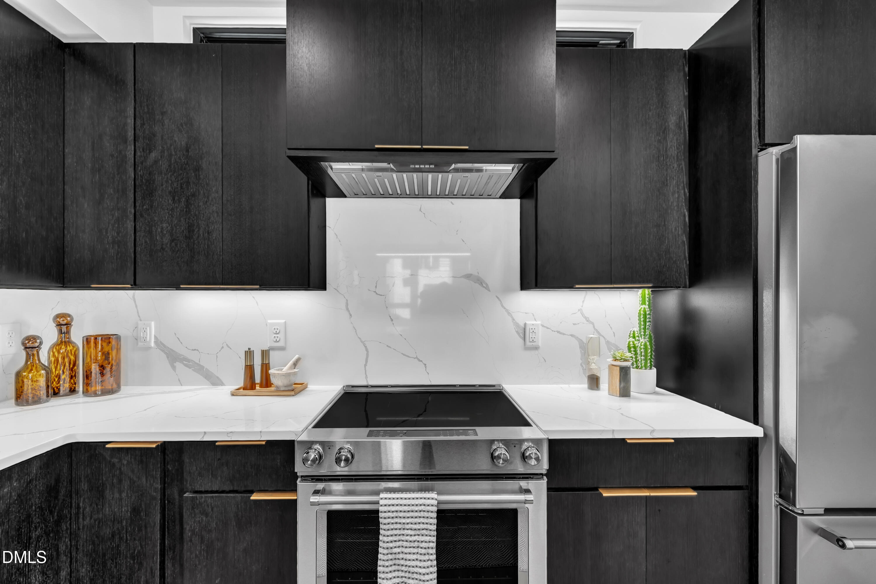 512 Gordon Street, Unit 305 Durham, NC 27701 - Photo 13 of 38 a kitchen with a stove and a refrigerator