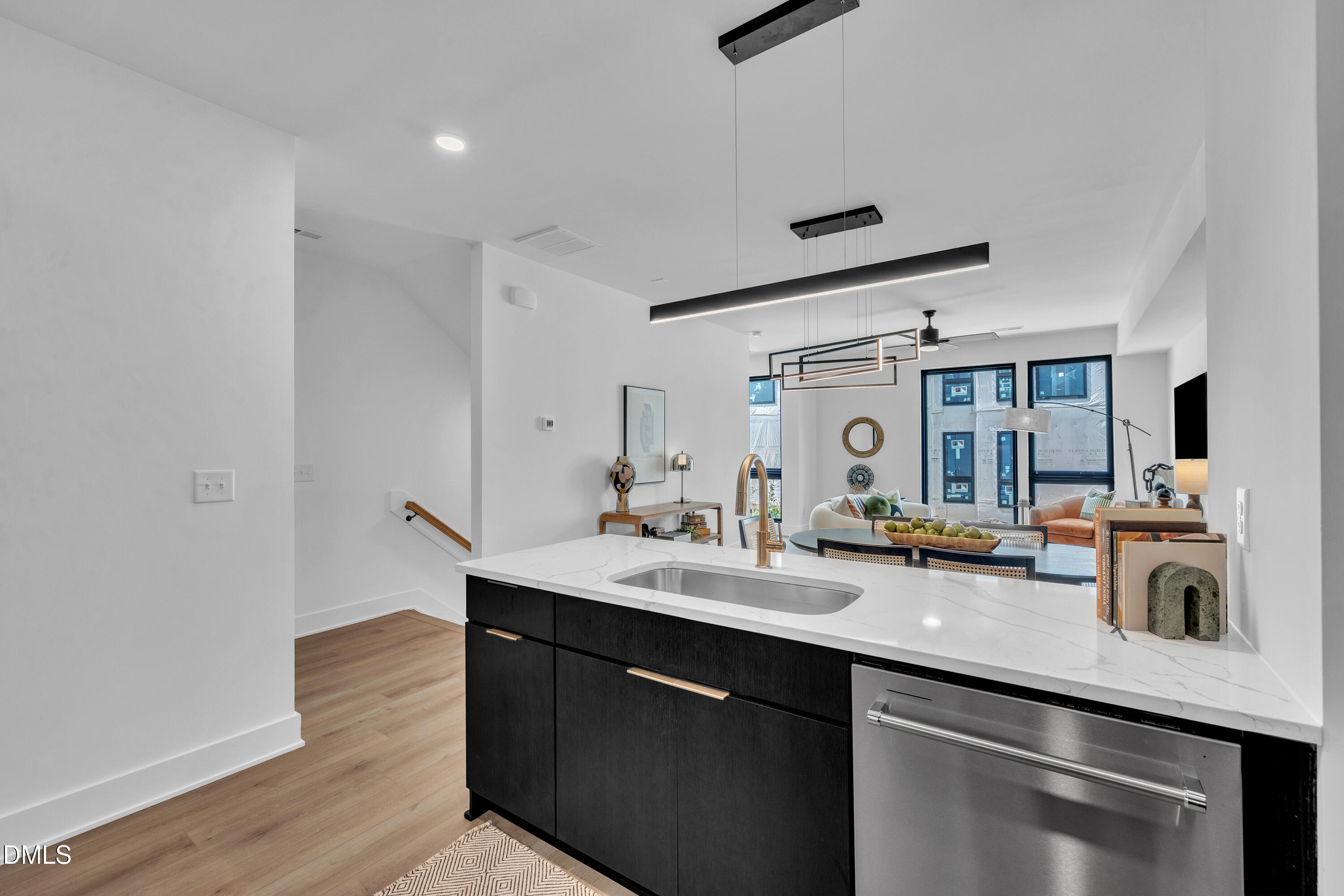 512 Gordon Street, Unit 305 Durham, NC 27701 - Photo 14 of 38 a kitchen with sink refrigerator and microwave