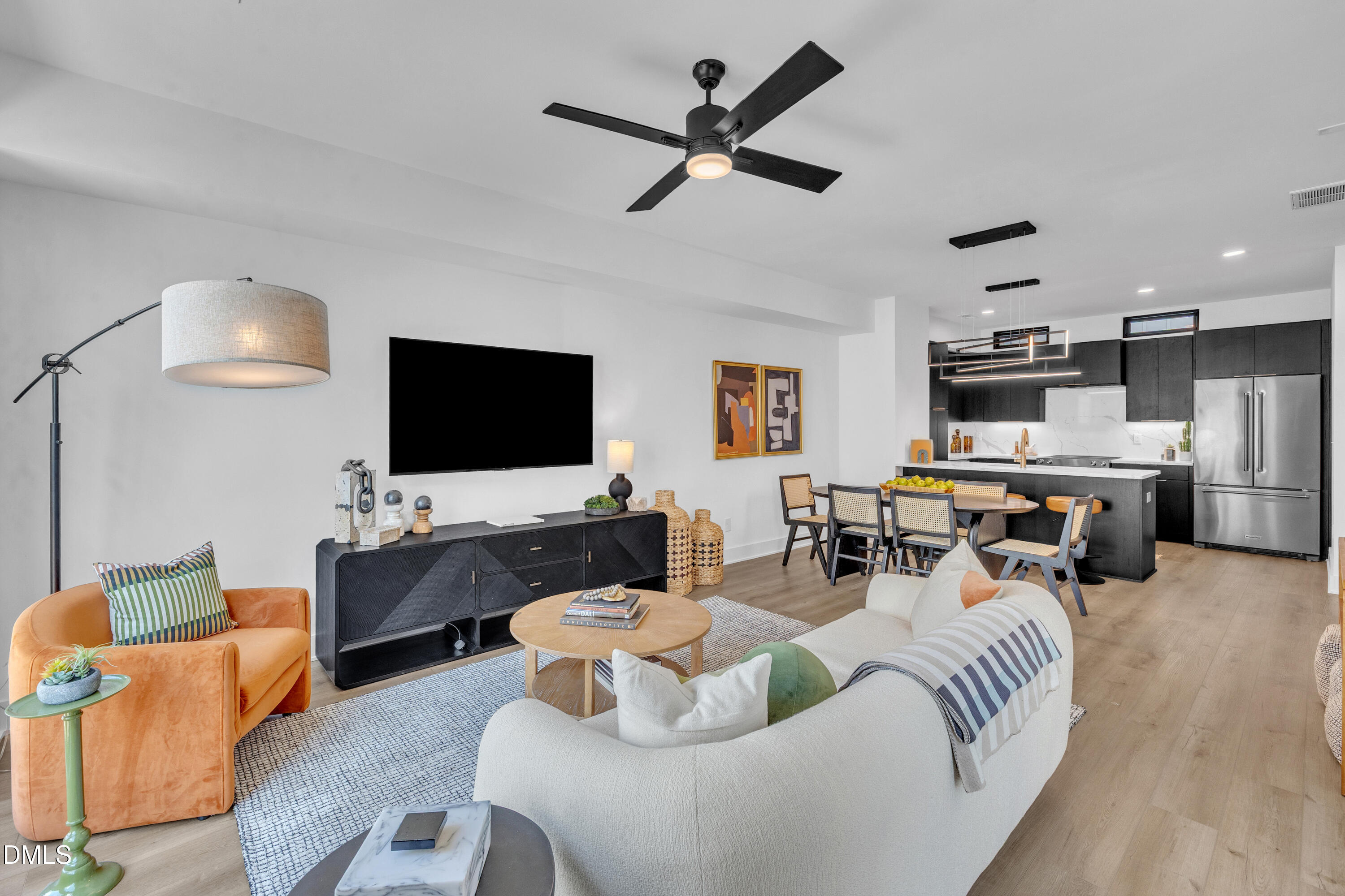 512 Gordon Street, Unit 305 Durham, NC 27701 - Photo 18 of 38 a living room with furniture and a flat screen tv
