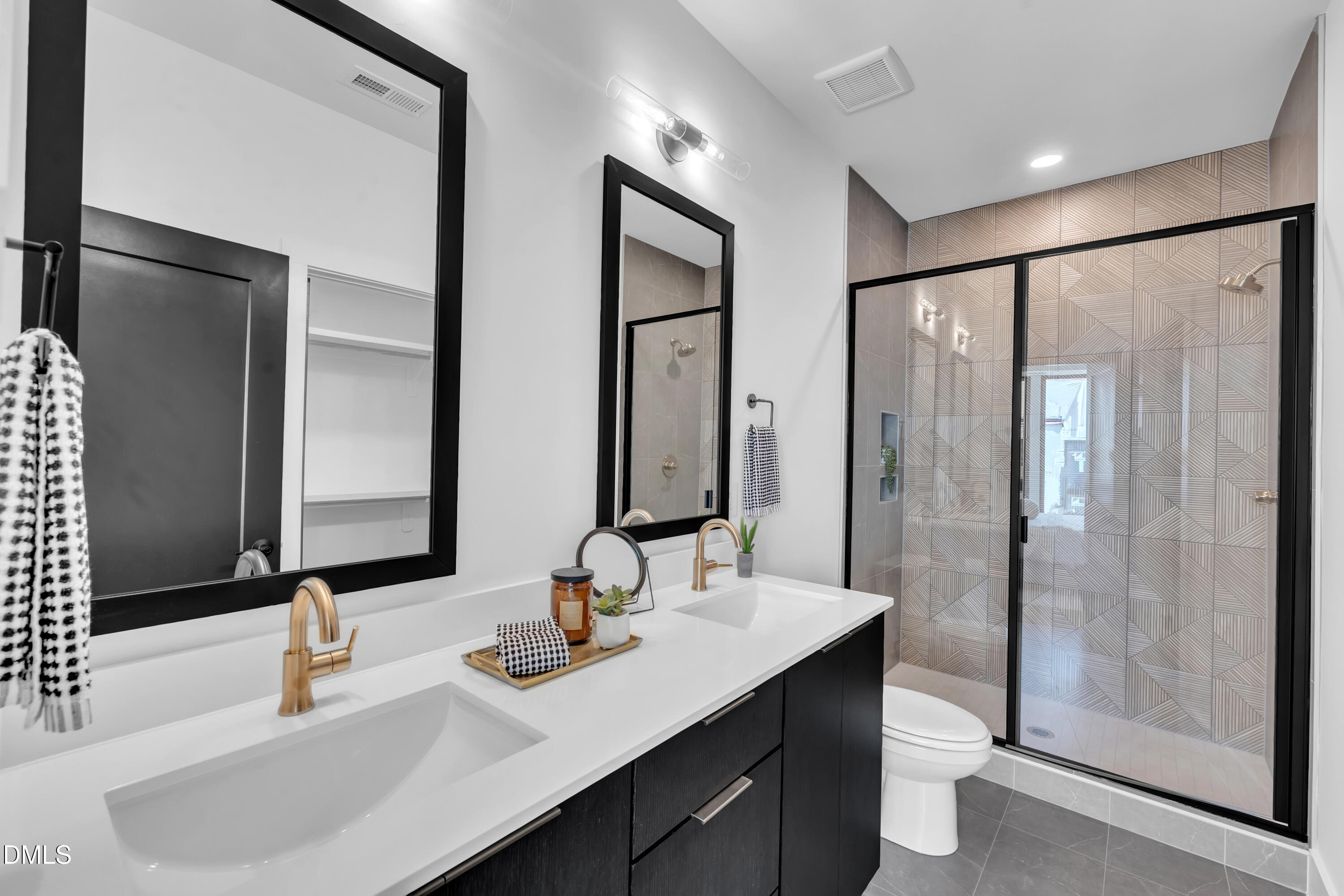 512 Gordon Street, Unit 305 Durham, NC 27701 - Photo 25 of 38 a bathroom with double vanity sink and a mirror