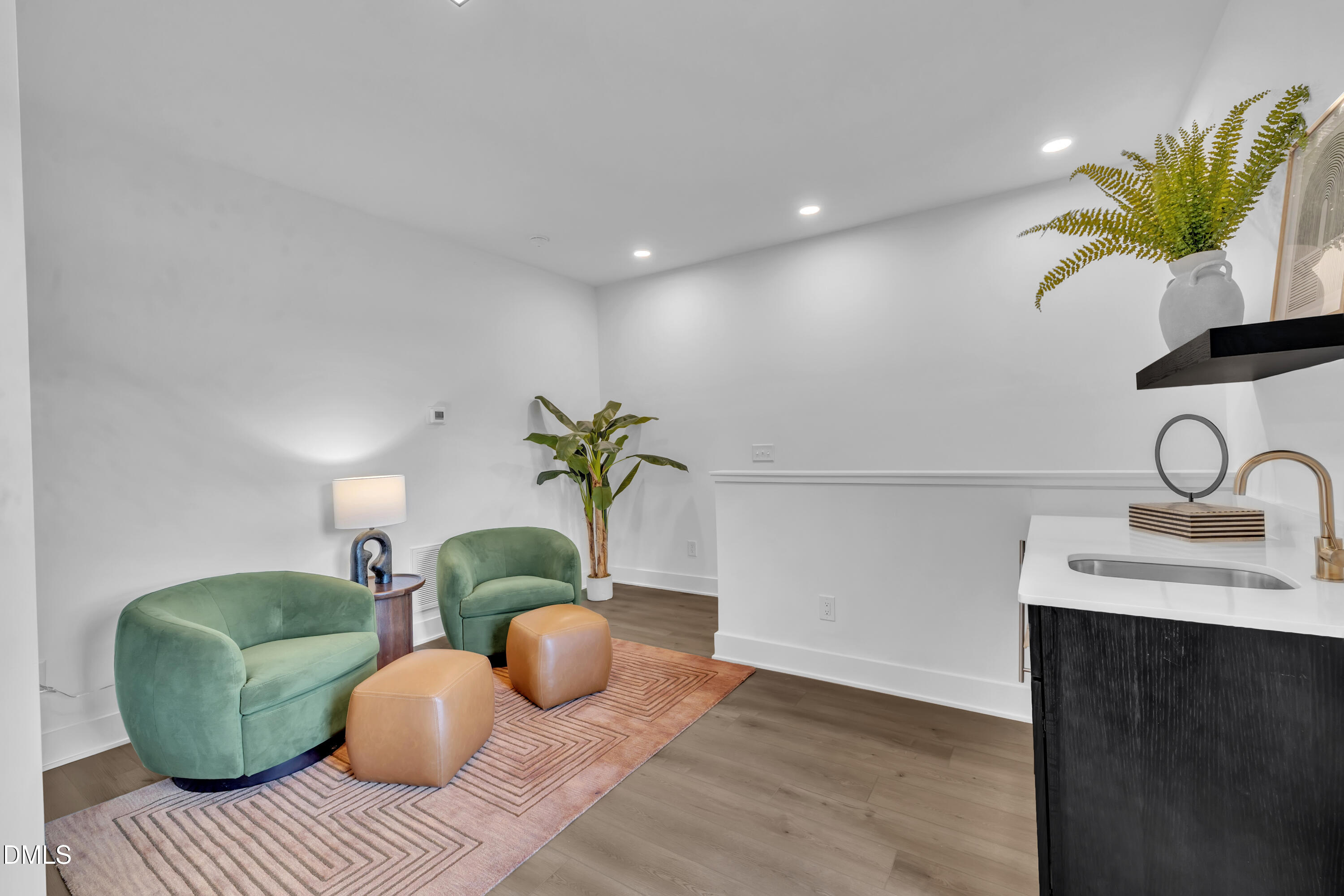 512 Gordon Street, Unit 305 Durham, NC 27701 - Photo 28 of 38 a living room with furniture flowerpot and wooden floor