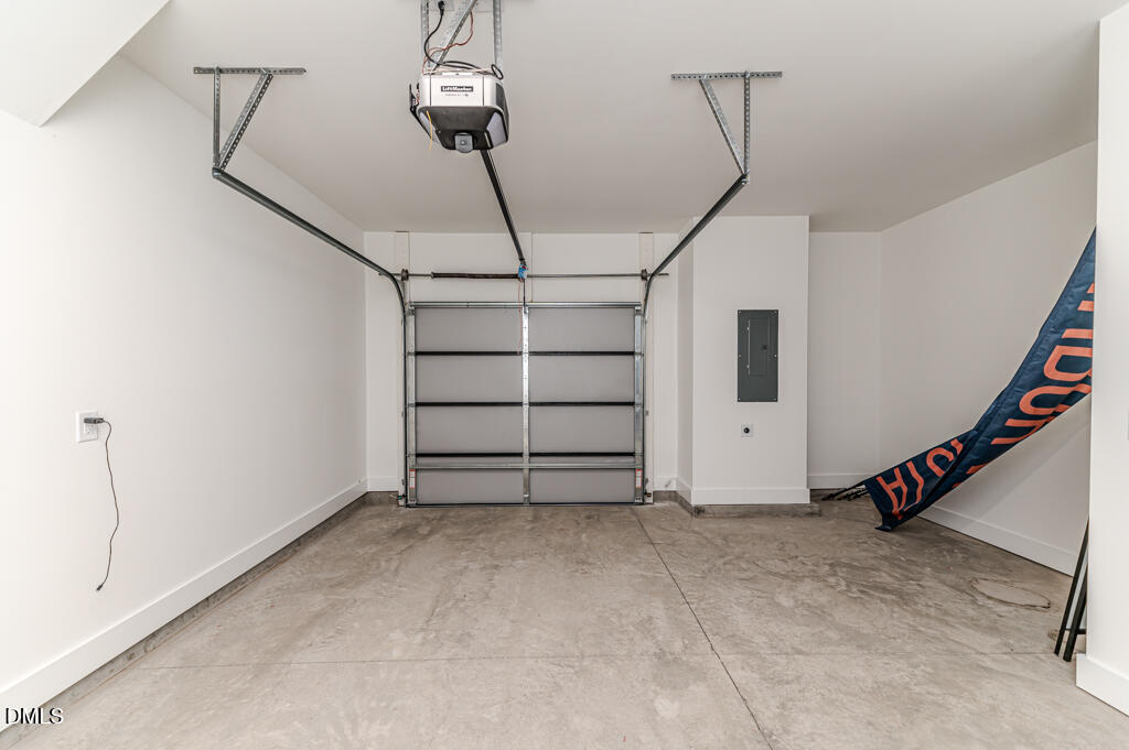 512 Gordon Street, Unit 305 Durham, NC 27701 - Photo 32 of 38 a view of a room with stairs and a chandelier