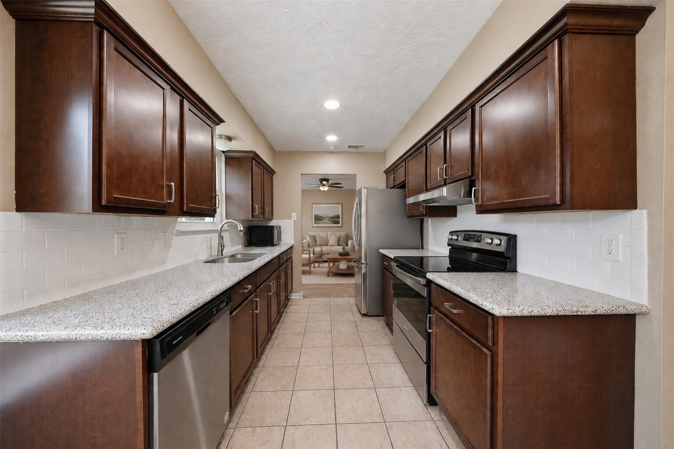 9418 Kilrenny Drive Spring, TX 77379 - Photo 3 of 47 a large kitchen with stainless steel appliances granite countertop lots of counter top space