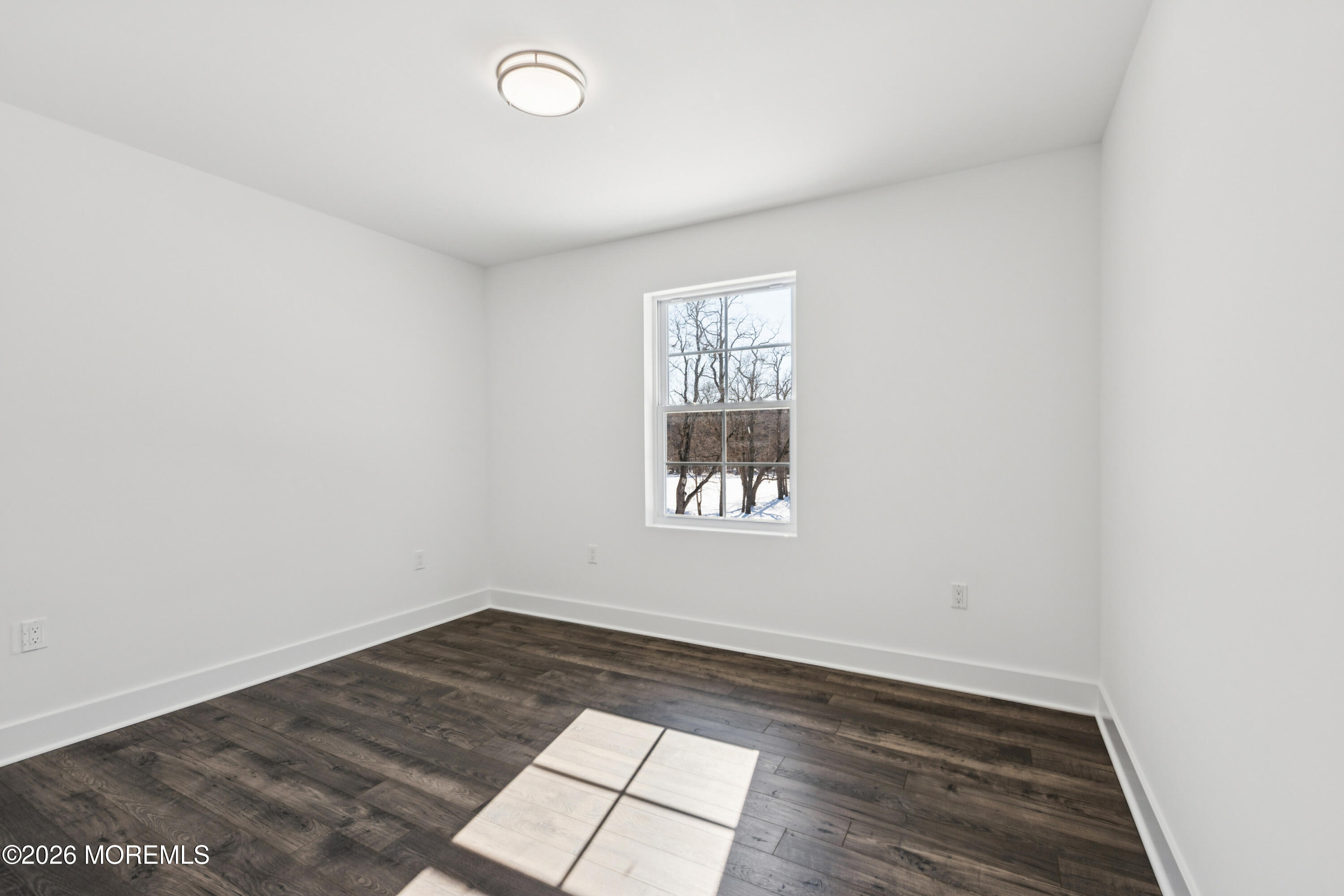 140 Locust Avenue Howell, NJ 07731 - Photo 21 of 25 an empty room with wooden floor and windows