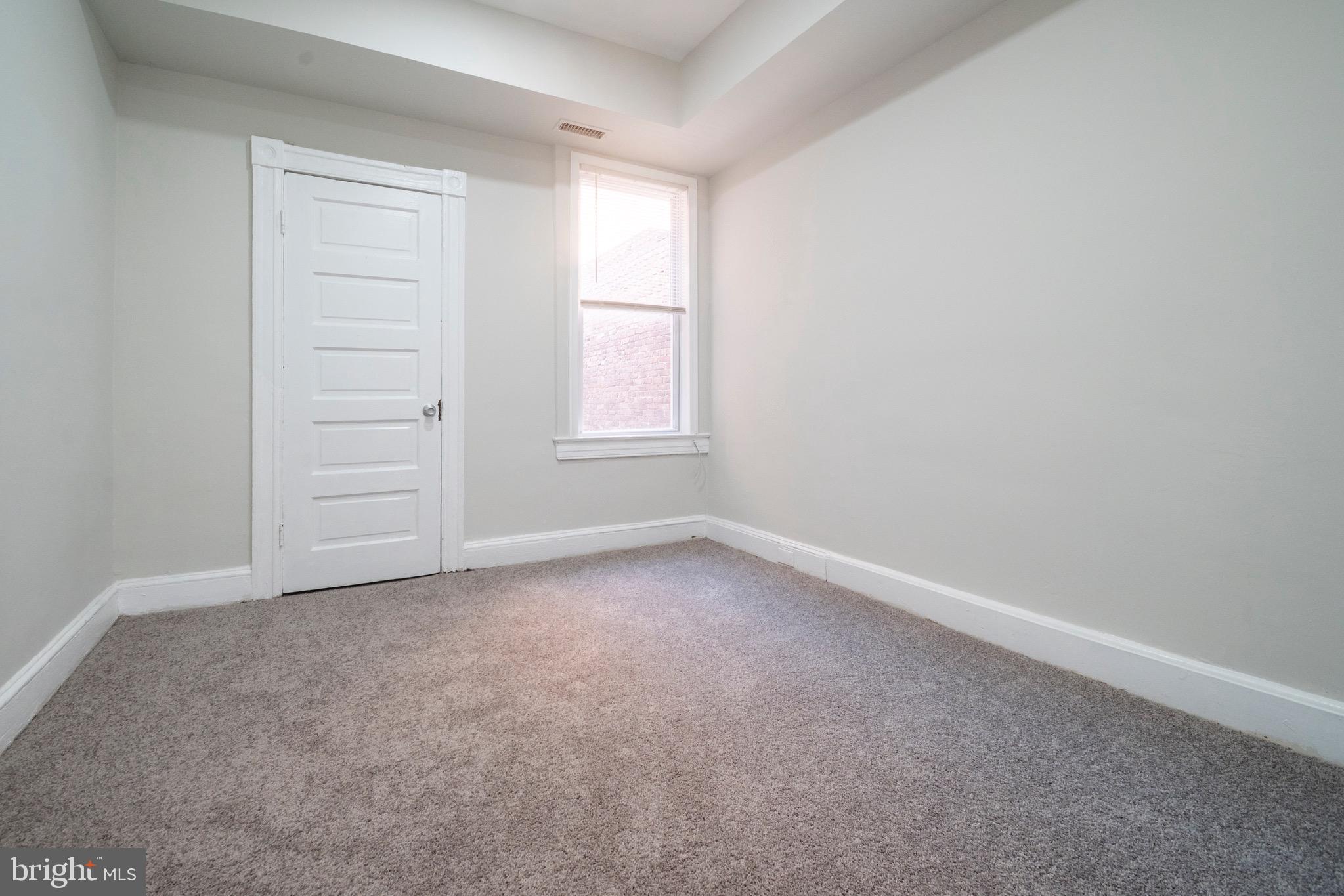 1626 Appleton Street Baltimore, MD 21217 - Photo 15 of 22 an empty room with windows and closet