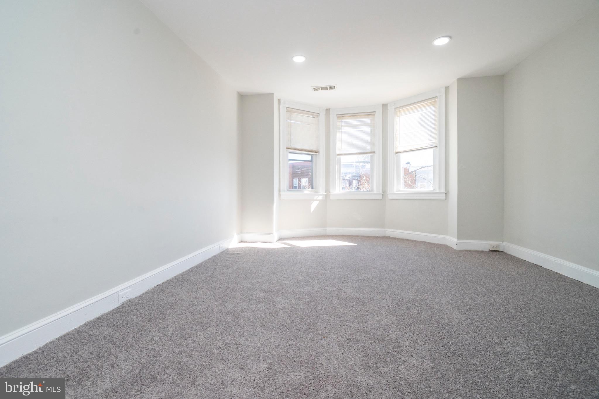 1626 Appleton Street Baltimore, MD 21217 - Photo 17 of 22 an empty room with windows