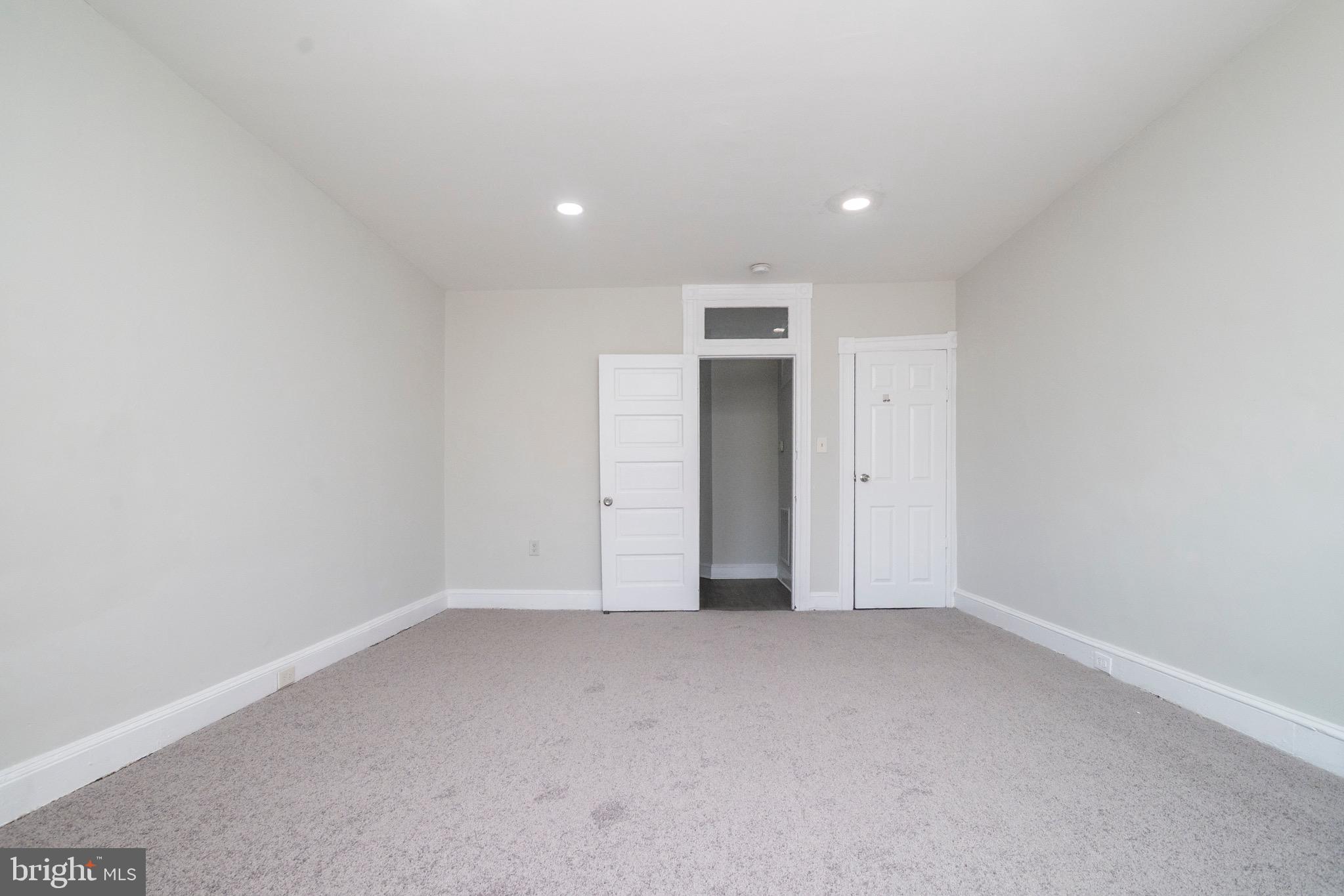 1626 Appleton Street Baltimore, MD 21217 - Photo 18 of 22 an empty room with an entryway