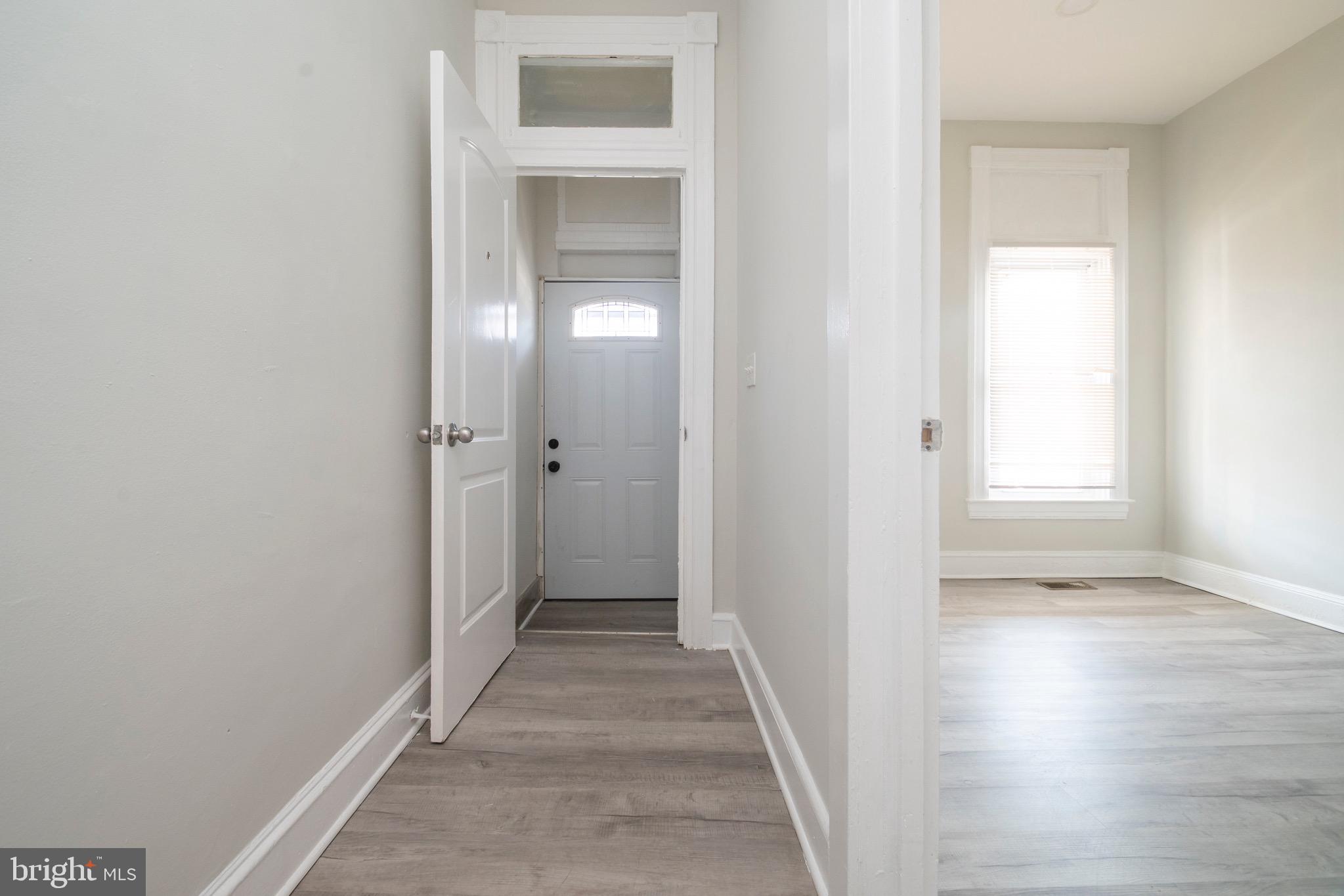 1626 Appleton Street Baltimore, MD 21217 - Photo 2 of 22 a view of a hallway with wooden floor