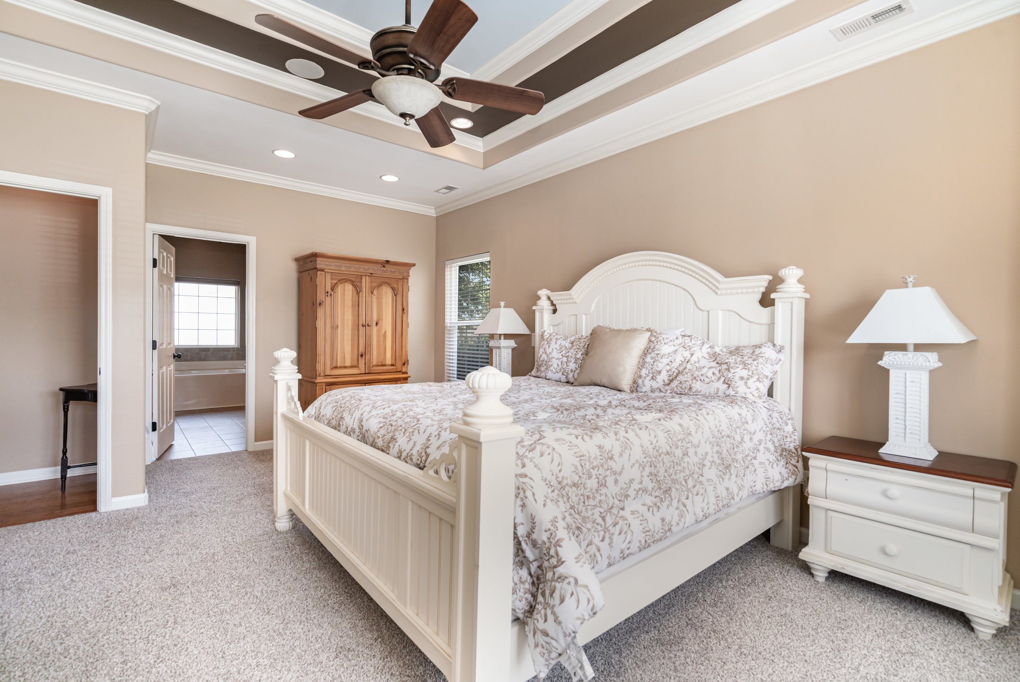 6015 Warner Court Spring Hill, TN 37174 - Photo 16 of 35 a bedroom with a bed and a chandelier