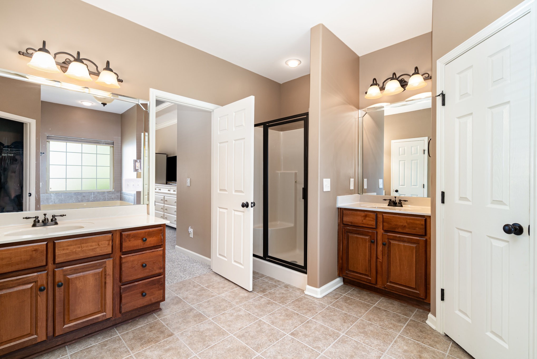 6015 Warner Court Spring Hill, TN 37174 - Photo 19 of 35 a spacious bathroom with a double vanity sink mirror and double