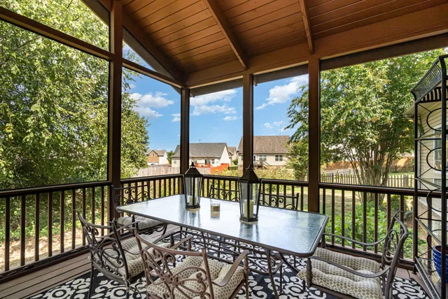 a view of a chair and table in the balcony