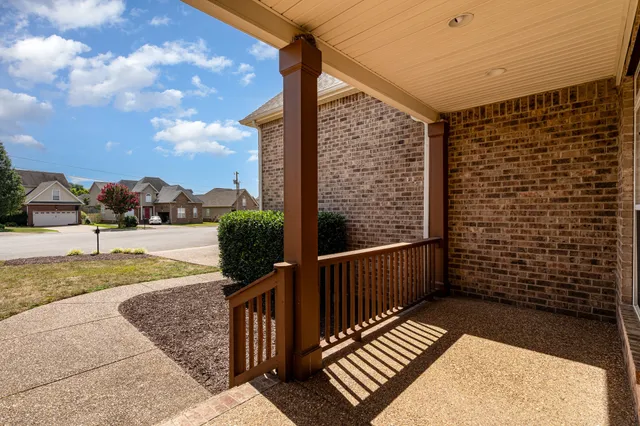 a view of balcony with wooden floor