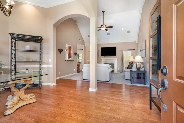 a view of a livingroom with furniture and a flat screen tv