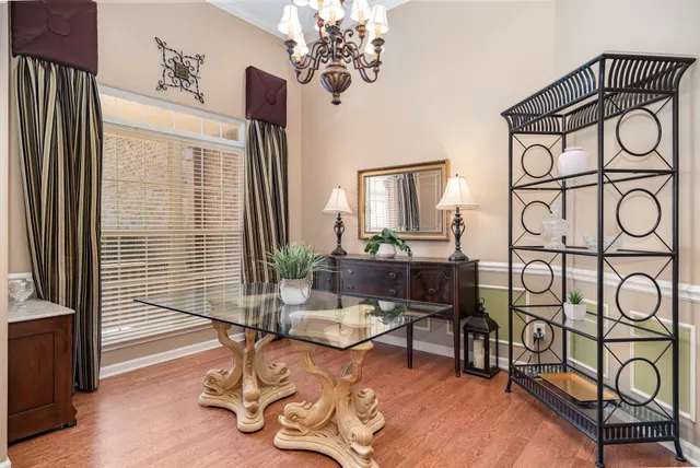 a view of a livingroom with furniture and a window