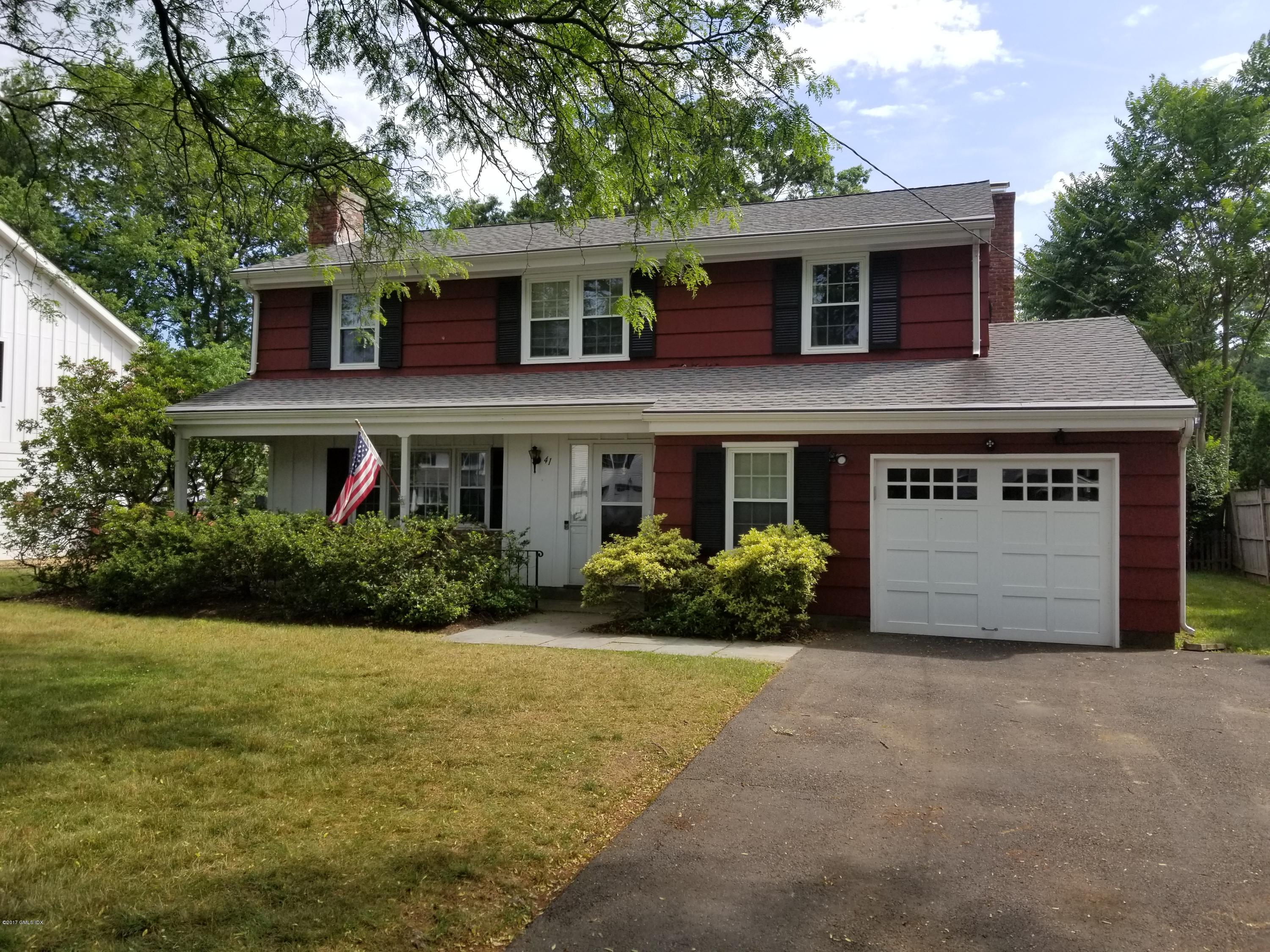41 Rainbow Drive Riverside, CT 06878 - Photo 1 of 1 a front view of house with yard and green space