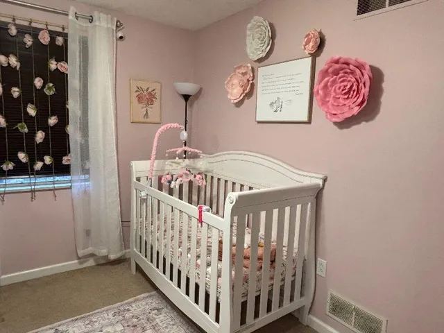 a view of a bedroom with furniture and staircase