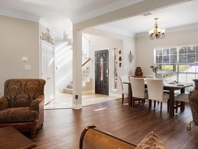an aerial view of a house with a yard and lake view