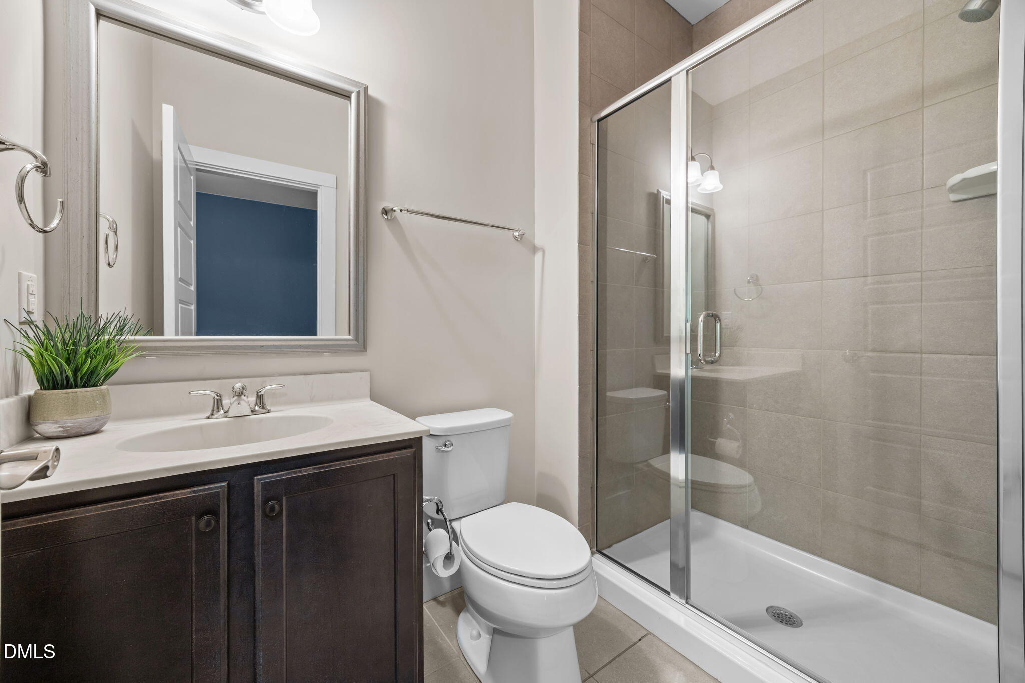 2791 Stone Rock Drive, Unit 113 Raleigh, NC 27604 - Photo 20 of 25 a bathroom with a sink toilet and shower