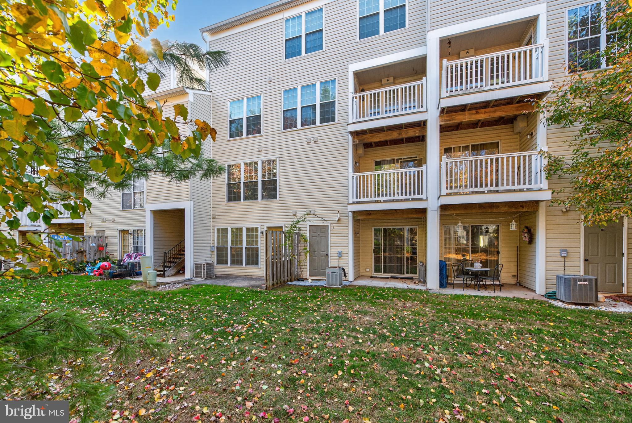 46932 Courtyard Square Sterling, VA 20164 - Photo 15 of 15 front view of a building with a yard