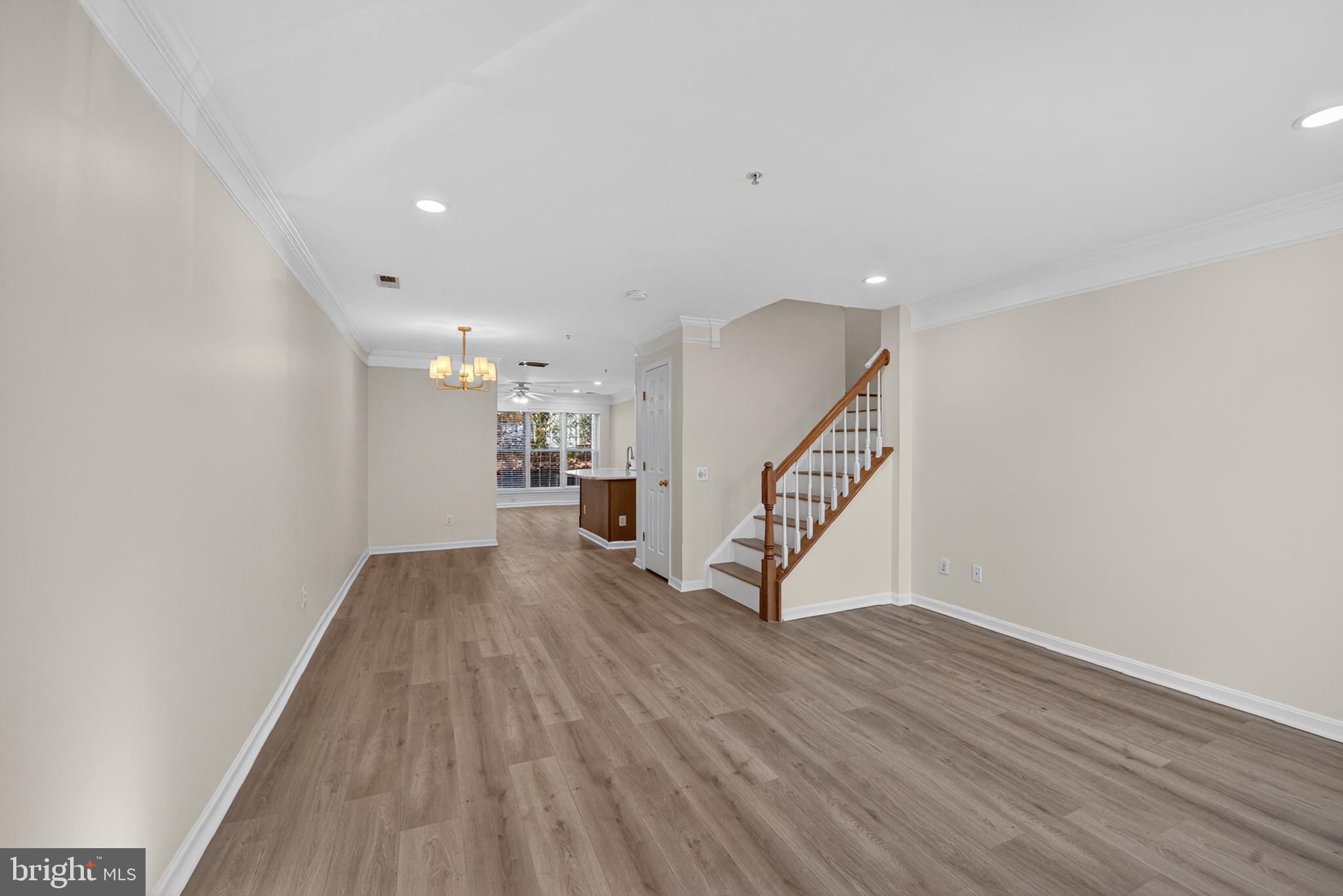 46932 Courtyard Square Sterling, VA 20164 - Photo 3 of 15 a view of a hallway with wooden floor and staircase