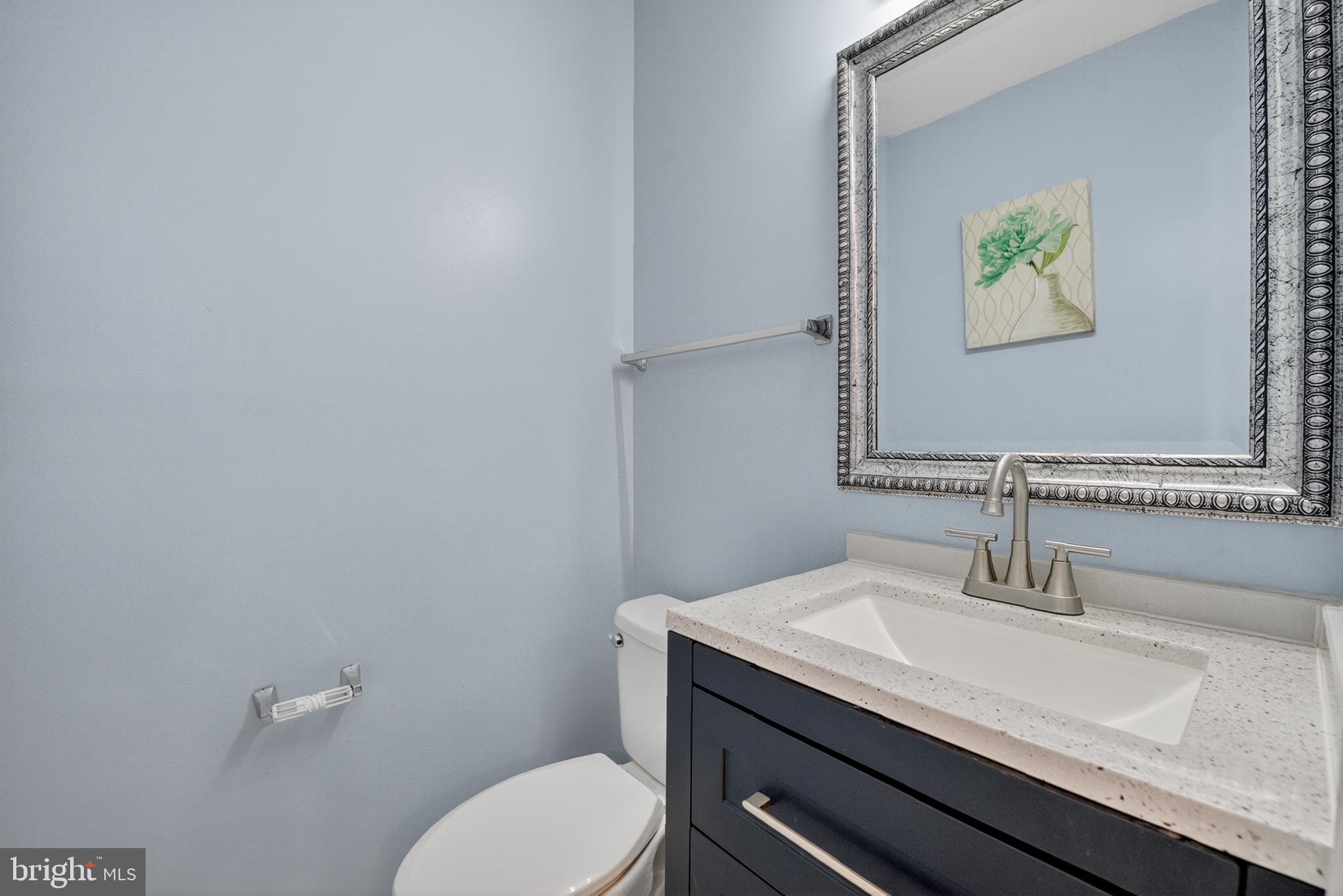 46932 Courtyard Square Sterling, VA 20164 - Photo 8 of 15 a bathroom with a granite countertop toilet sink and mirror