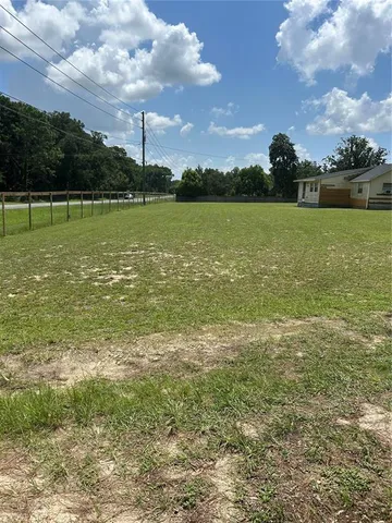 a view of a lake with a big yard