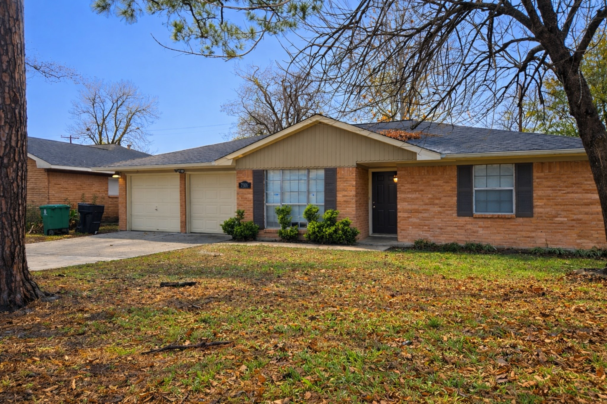 7306 Troulon Drive Houston, TX 77074 - Photo 3 of 16 a front view of a house with garden