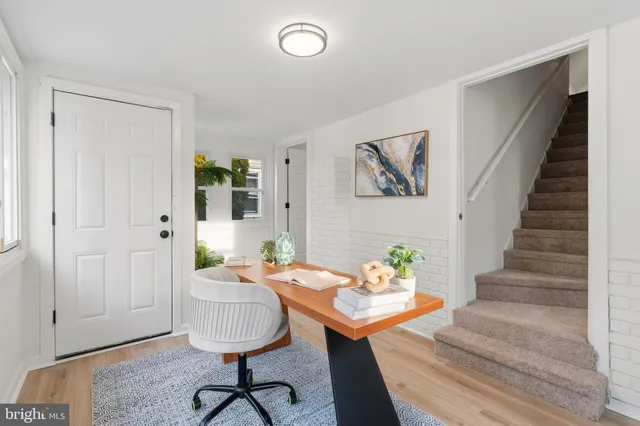 a view of a livingroom with furniture and furniture