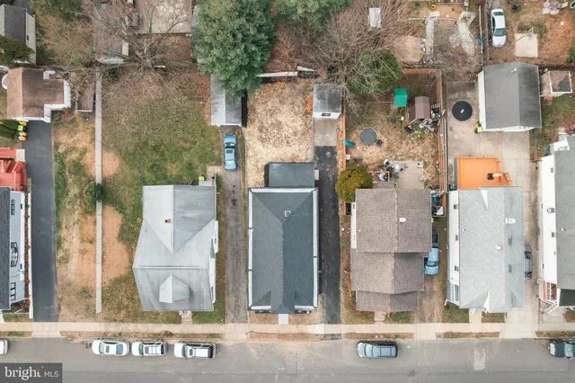 an aerial view of residential house with outdoor space and parking