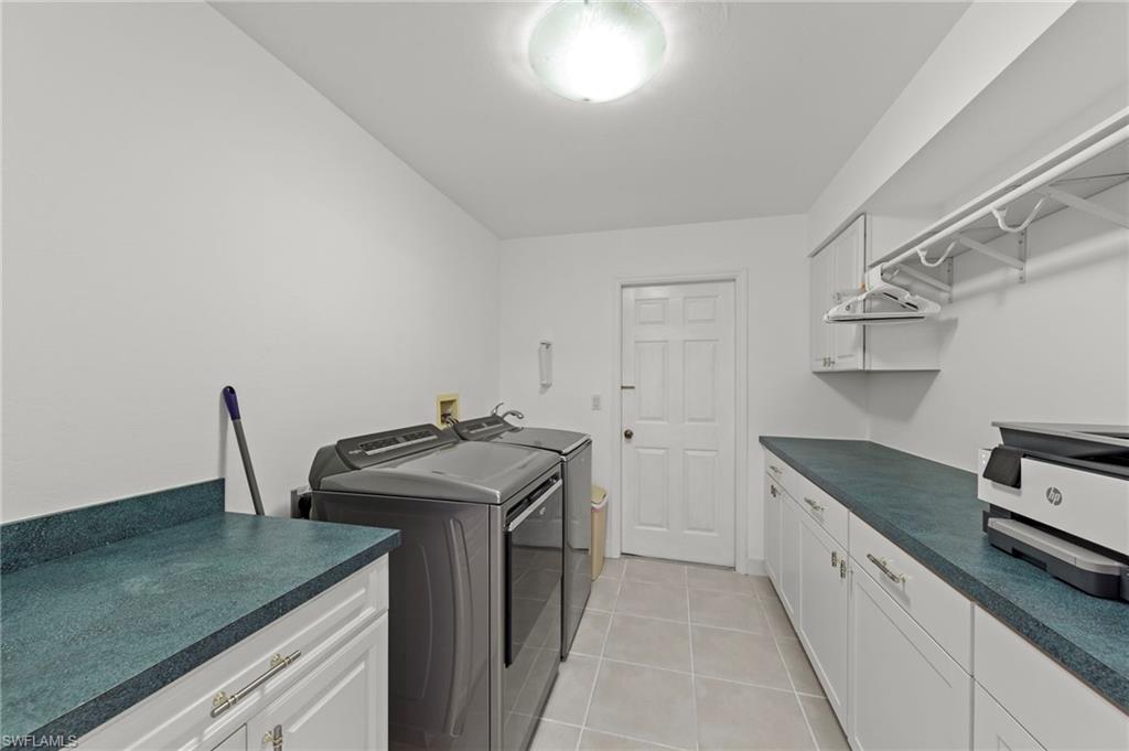 13541 Stringfellow Road Bokeelia, FL 33922 - Photo 34 of 49 a kitchen that has a sink and a stove