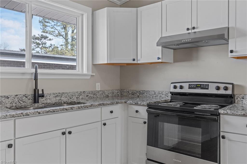 511 Saunders Place, Unit A & B High Point, NC 27260 - Photo 18 of 29 Kitchen with granite countertop, double bowl sink and lots of cabinet storages-Unit B.