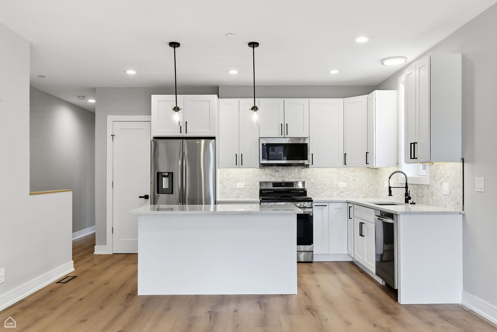 2718 Budd Street River Grove, IL 60171 - Photo 11 of 145 a kitchen with stainless steel appliances kitchen island granite countertop a sink a stove a refrigerator and white cabinets with wooden floor