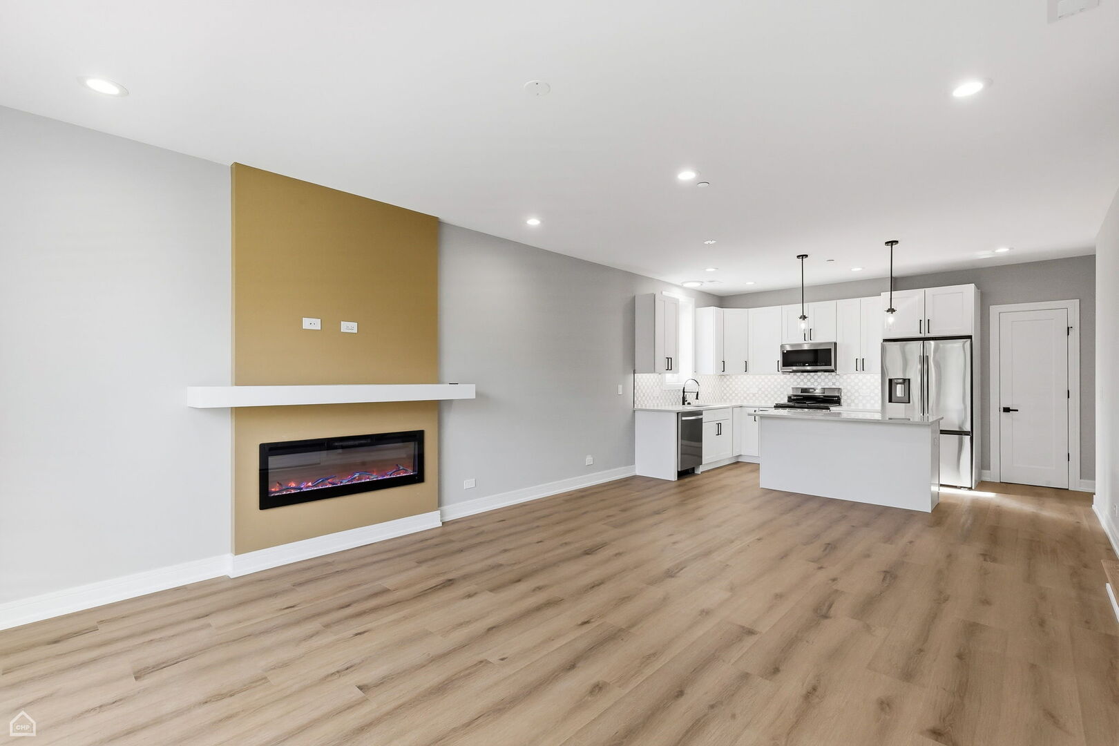 2718 Budd Street River Grove, IL 60171 - Photo 115 of 145 a view of kitchen with kitchen island wooden floor center island and stainless steel appliances