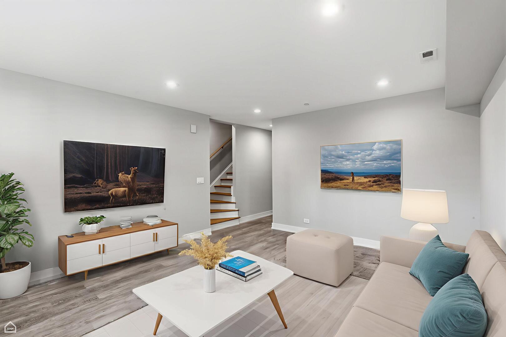 2718 Budd Street River Grove, IL 60171 - Photo 32 of 145 a living room with furniture and a flat screen tv