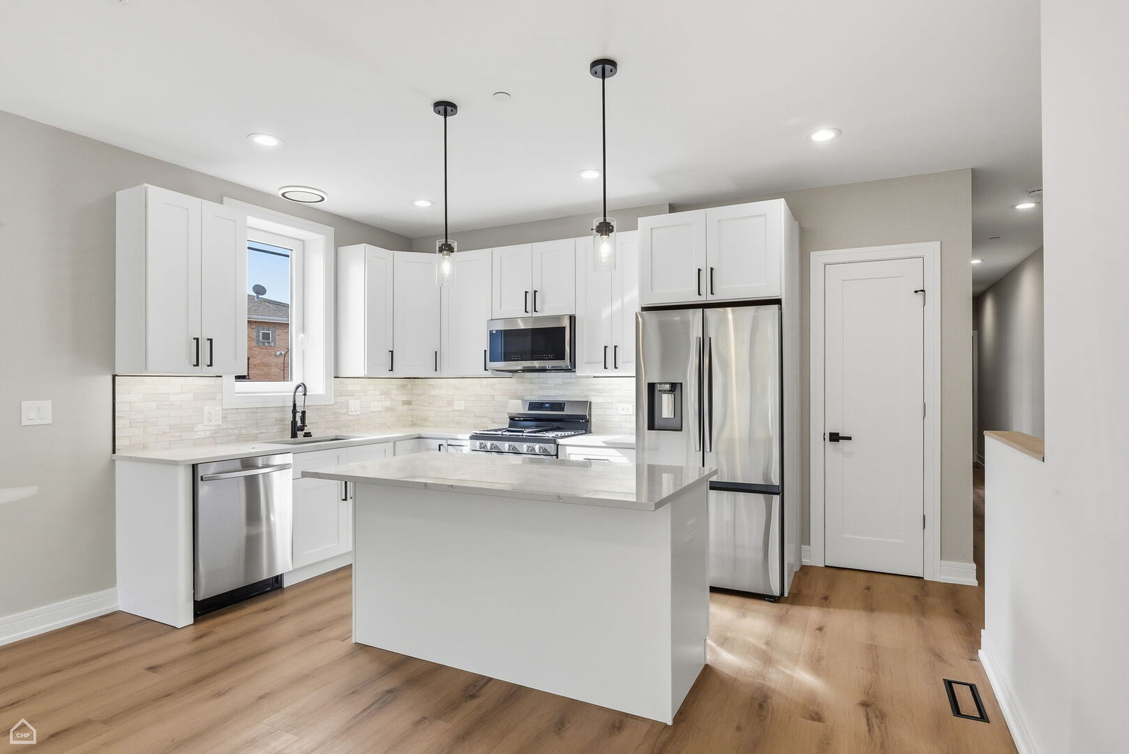 2718 Budd Street River Grove, IL 60171 - Photo 47 of 145 a kitchen with stainless steel appliances granite countertop a refrigerator a sink dishwasher a stove and white cabinets with wooden floor