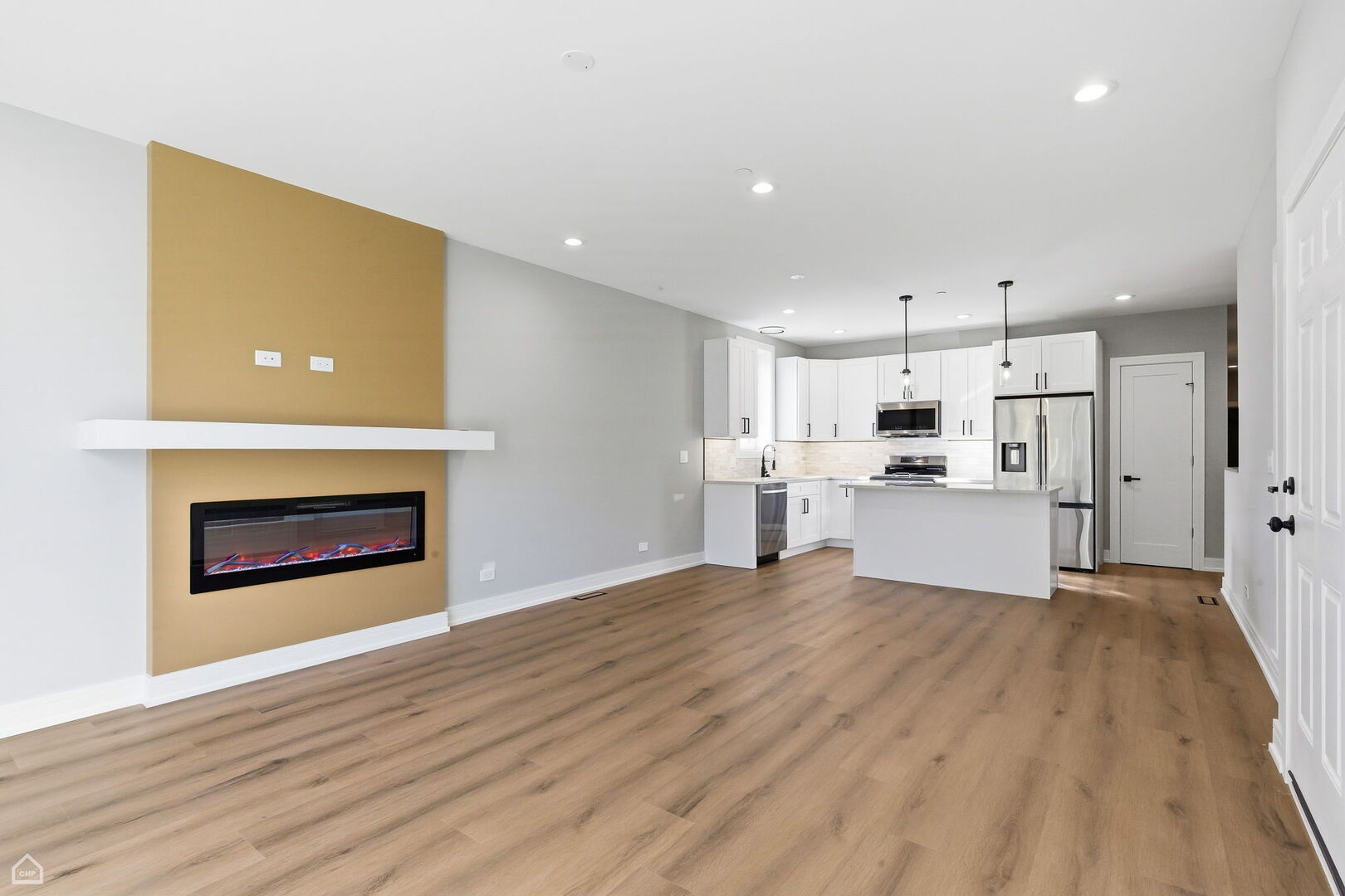 2718 Budd Street River Grove, IL 60171 - Photo 53 of 145 a view of kitchen with kitchen island wooden floor center island and stainless steel appliances