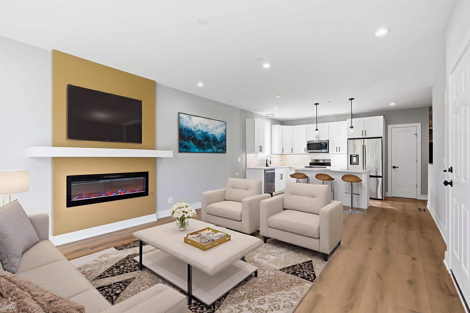 2718 Budd Street River Grove, IL 60171 - Photo 54 of 145 a living room with furniture a fireplace and a flat screen tv