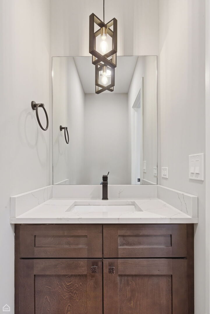 2718 Budd Street River Grove, IL 60171 - Photo 55 of 145 a bathroom with a sink and a mirror