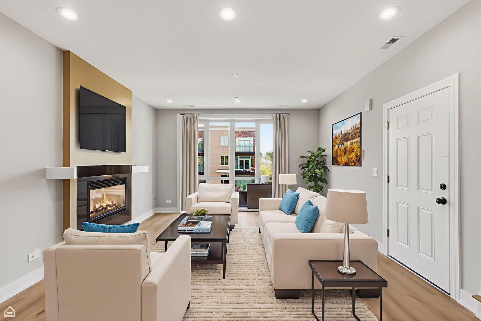 2718 Budd Street River Grove, IL 60171 - Photo 83 of 145 a living room with furniture a fireplace and a flat screen tv