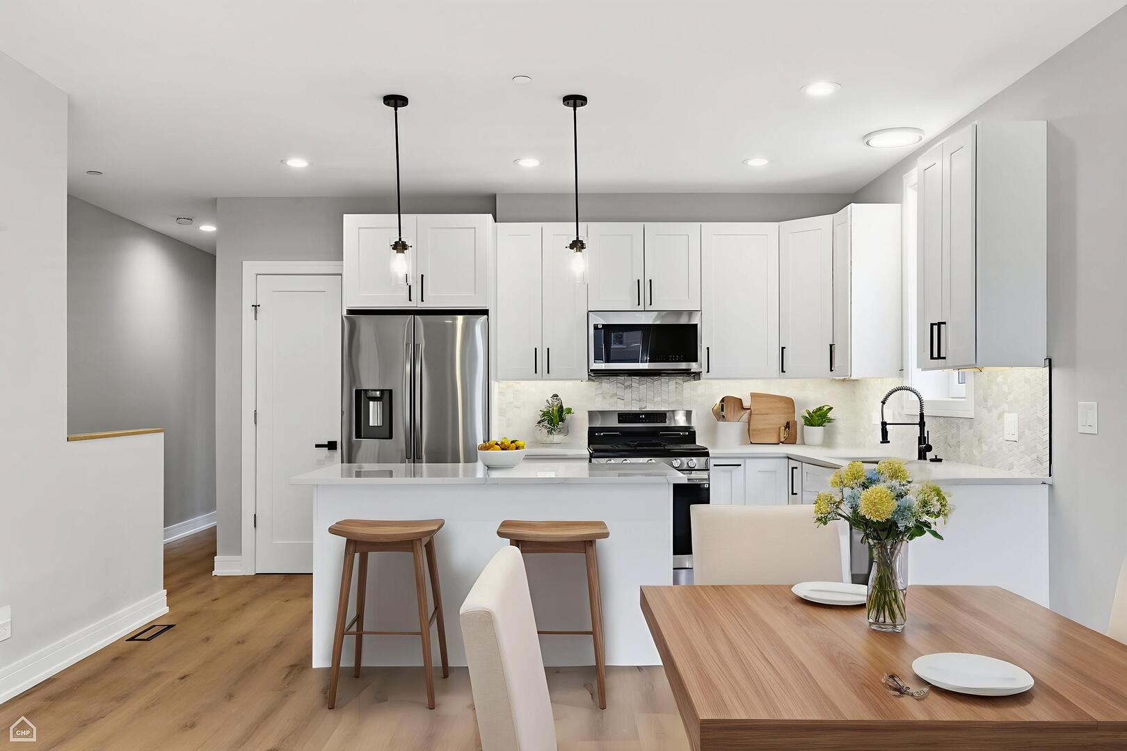 2718 Budd Street River Grove, IL 60171 - Photo 84 of 145 a kitchen with stainless steel appliances granite countertop a kitchen island hardwood floor and a sink