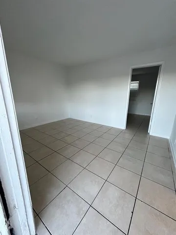 a view of an empty room and an entrance