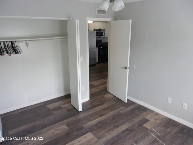 an empty room with wooden floor