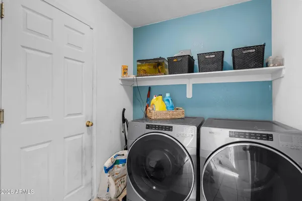 a utility room with dryer and washer