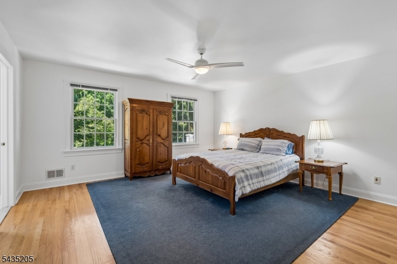 12 Oak Hill Road Bernards, NJ 07920 - Photo 16 of 33 a bedroom with a bed couch and window