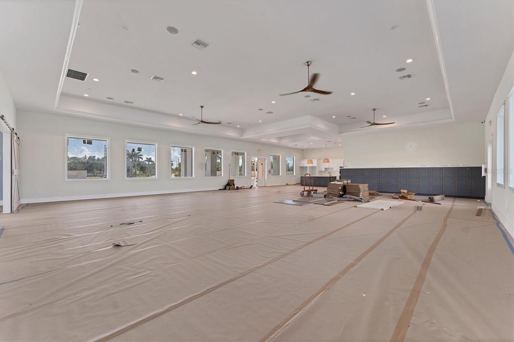 9001 Gasparilla Road, Unit 35 Placida, FL 33947 - Photo 30 of 79 a room with lots of wooden furniture and view of kitchen