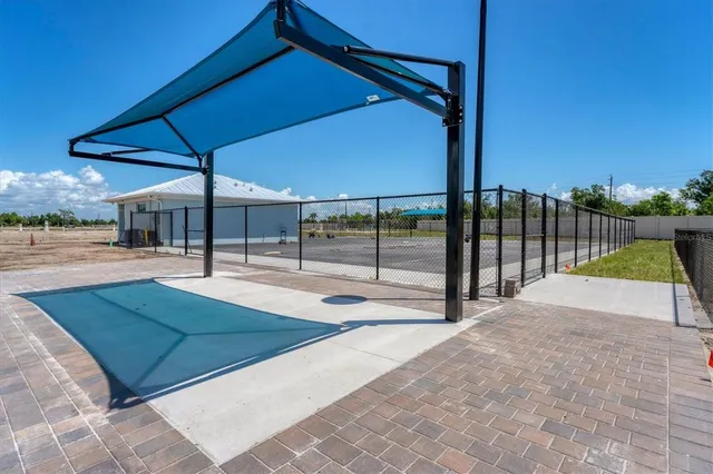 a view of a swimming pool with a yard